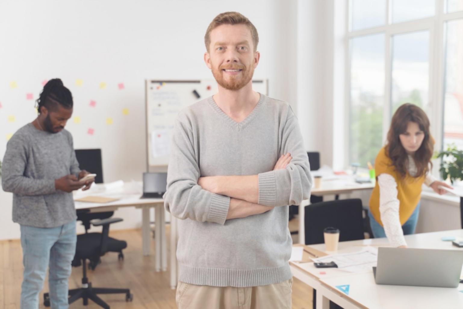 Group discussion during financial planning workshop with participants reviewing investment strategies and budget worksheets